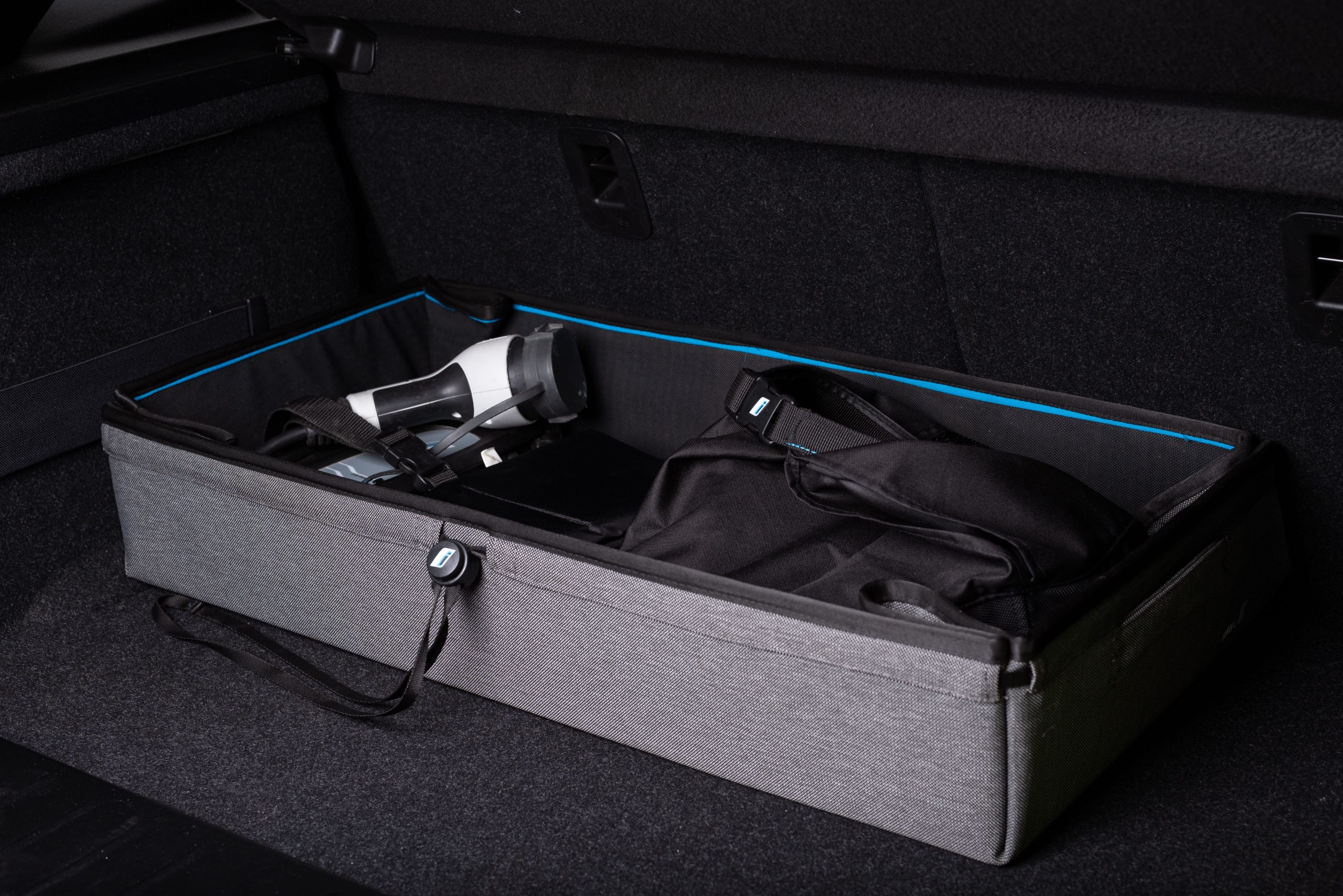 Vehicle cargo storage organizer in car trunk