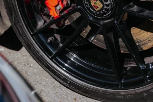 Automotive brake rotor, caliper and wheel close-up