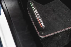 Protective automotive floor mat inside vehicle cabin